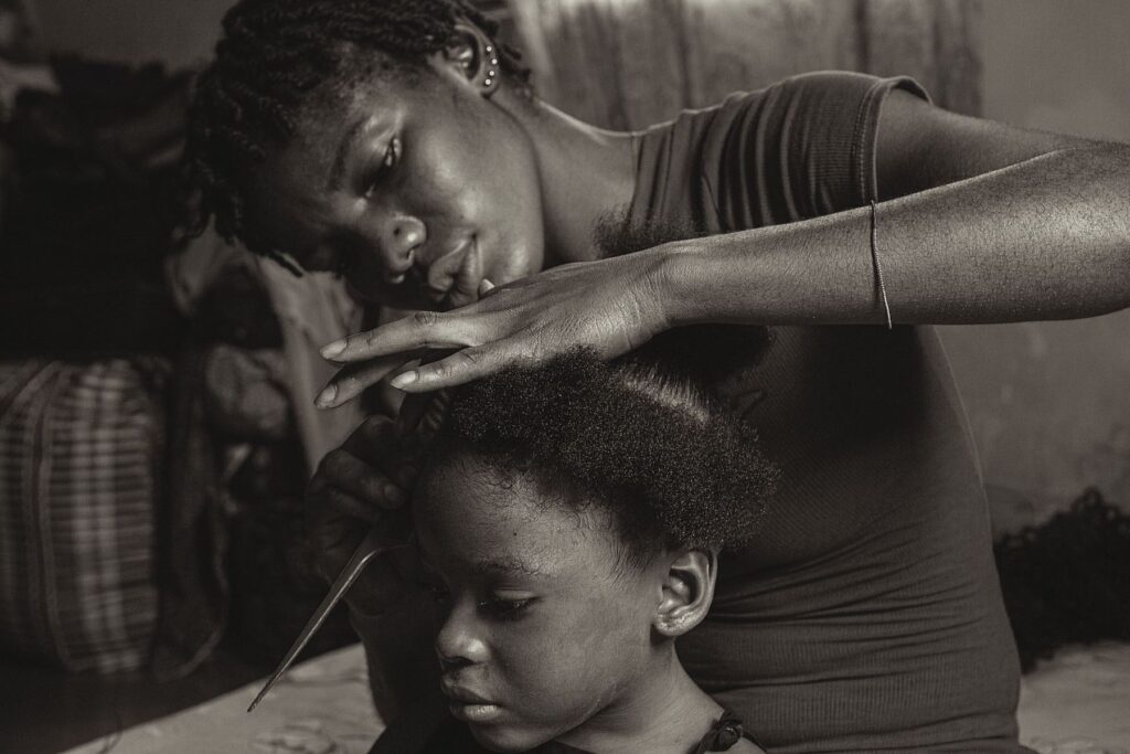Black and white close portrait of a mother and daughter