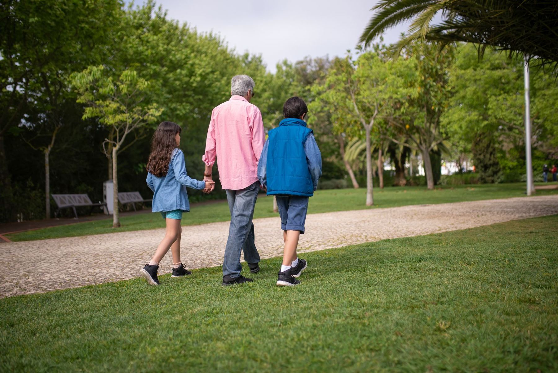 A family walking together across a park